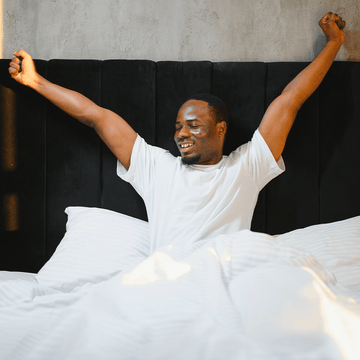 A man waking up in the morning feeling refreshed